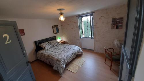 Ένα ή περισσότερα κρεβάτια σε δωμάτιο στο Chambre 2 Le Clos des Quatre Lieues