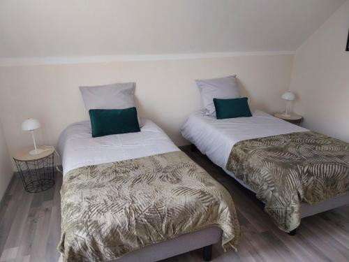 Postel nebo postele na pokoji v ubytování Le gîte Maimbevillois