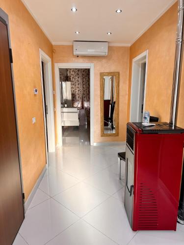 a living room with a red appliance in a room at Casa Gena in Favaro Veneto