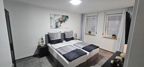 a bedroom with a large bed in a room at Doppelzimmer in der Altstadt in Nürtingen