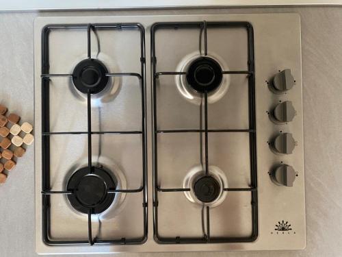 a stove top with four burners on it at La dimora dei Sanniti in Busso