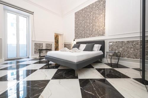 Giường trong phòng chung tại Nitti 76 Luxury Apartment
