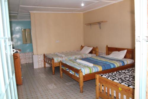 Ένα ή περισσότερα κρεβάτια σε δωμάτιο στο Tranquil Homestays