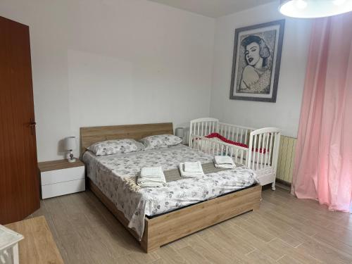 Ένα ή περισσότερα κρεβάτια σε δωμάτιο στο Casa Sole Sofiè