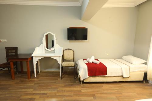 Postel nebo postele na pokoji v ubytování BALŞEN HOTEL