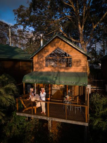 two people standing on a porch of a house at The Polish Place in Mount Tamborine