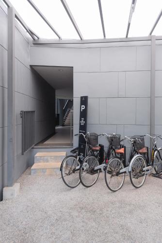 a row of bikes parked next to a building at Panoramic Pool at The Valley in Pak Chong