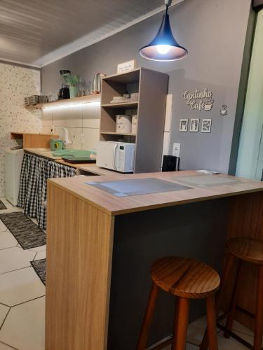 Kuchyň nebo kuchyňský kout v ubytování Apartamento Container com Sacada, Split e Estacionamento