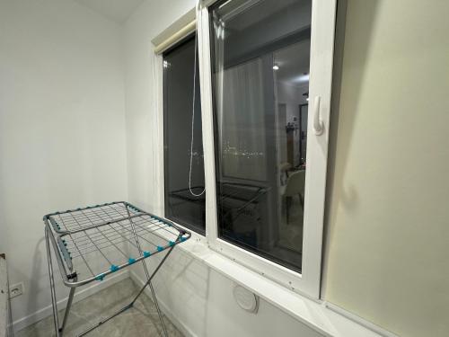 a window in a room with a shelf next to it at EXPO Premium in Prigorodnyy