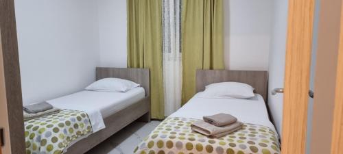 Katil atau katil-katil dalam bilik di Apartman Kika