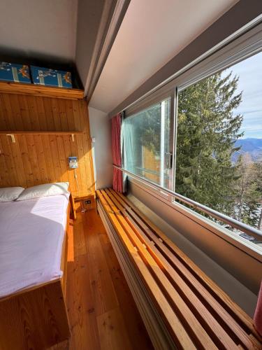 Postel nebo postele na pokoji v ubytování Casetta al Sole Alto