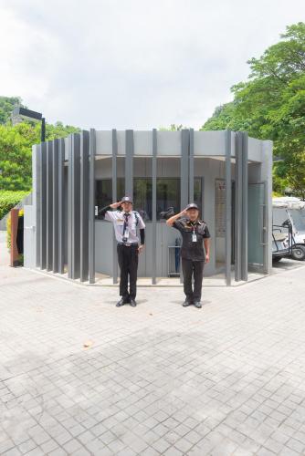 two men standing in front of a building at The Valley at Sunshine, Panoramic in Pak Chong