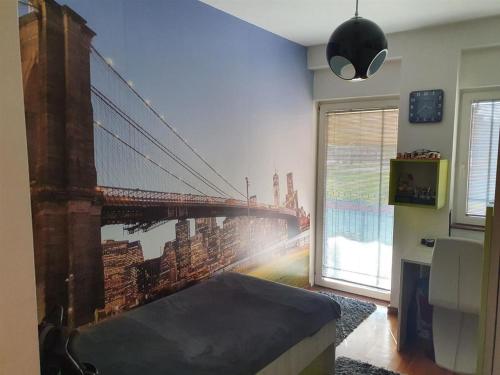 a bedroom with a mural of a bridge at Modern Retreat in Skopje