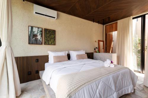 Cama ou camas em um quarto em Natu Boutique Stays