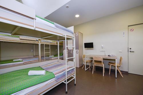 Postel nebo postele na pokoji v ubytování Nykščio Hostel
