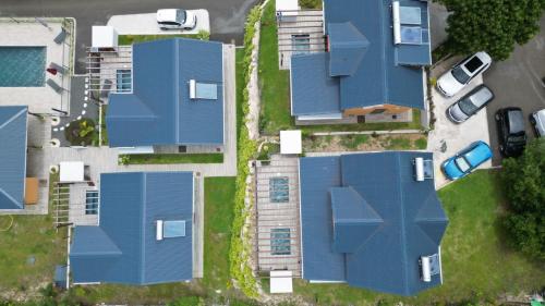 an overhead view of houses with blue roofs at Gîte Dalina in Saint-François
