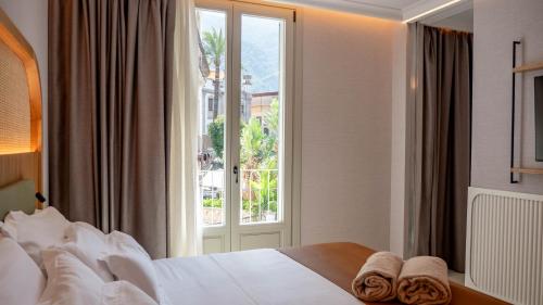 Postel nebo postele na pokoji v ubytování Alcázar Hotel Sóller