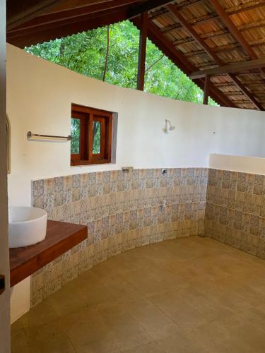 Φωτογραφία από το άλμπουμ του Banyan Beach Cottage SRI LANKA σε Kalapu