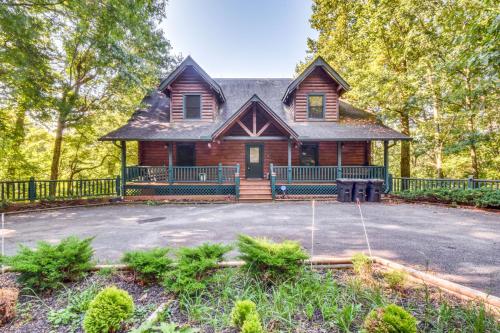 a log house with a driveway in front of it at Expansive Sky Valley Lodge with Mountain Views! in Sky Valley