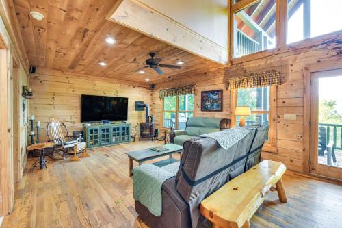 a living room with a couch and a tv at Expansive Sky Valley Lodge with Mountain Views! in Sky Valley