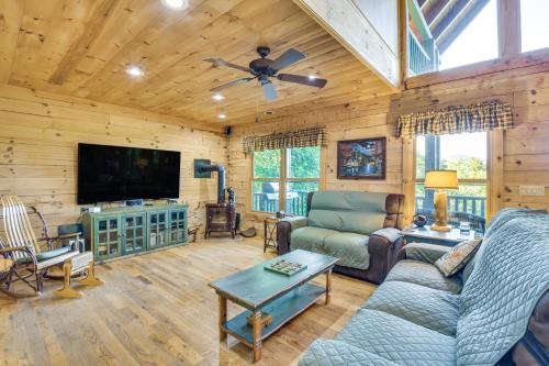 a living room with a couch and a flat screen tv at Expansive Sky Valley Lodge with Mountain Views! in Sky Valley