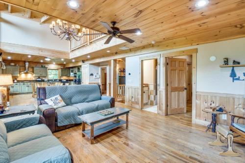a living room with a couch and a ceiling fan at Expansive Sky Valley Lodge with Mountain Views! in Sky Valley