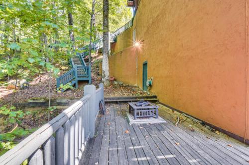 a wooden deck with a bench and a fence at Expansive Sky Valley Lodge with Mountain Views! in Sky Valley
