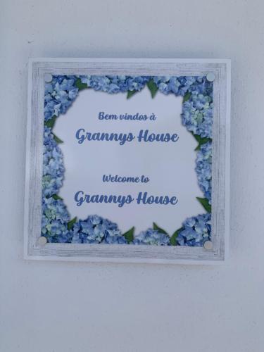a framed picture of blue hydrangeas at Grannys House in Angra do Heroísmo