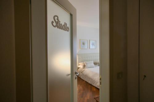 a door leading to a bedroom with a bed at Pietra E Glicine B&B in Pieve a Nievole