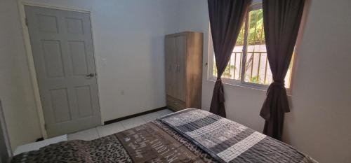 Ένα ή περισσότερα κρεβάτια σε δωμάτιο στο Comva-Housing