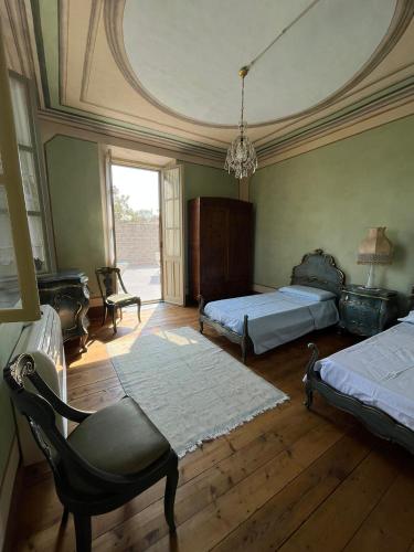 Ένα ή περισσότερα κρεβάτια σε δωμάτιο στο Casa Vacanze Pirulla