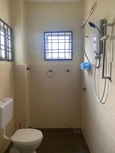 a bathroom with a shower and a toilet at Bangi in Kajang