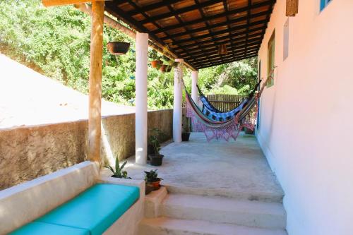 クムルサティバにあるCasa Passarinhosの家の縁側