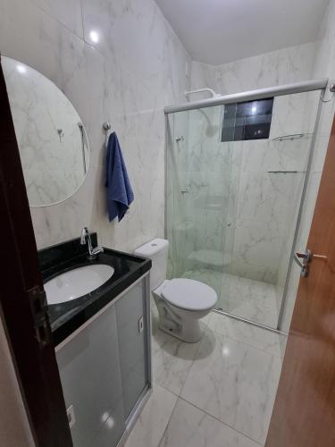 a bathroom with a shower and a toilet and a sink at Apartamento 201 Mar in Conde