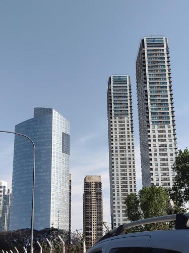 a group of tall buildings in a city at Depto torre Bayres Obelisco in Buenos Aires