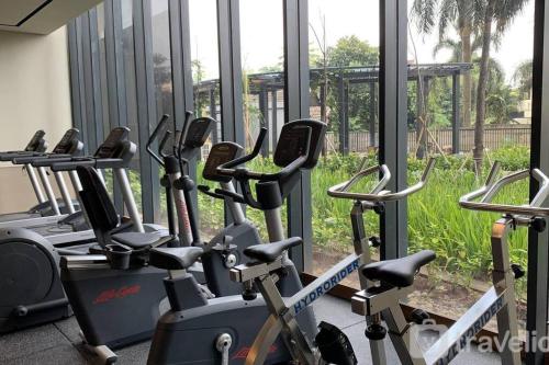 a row of exercise bikes in a gym at Southgate Residence, Ellegance in Jakarta