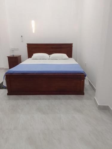 Ένα ή περισσότερα κρεβάτια σε δωμάτιο στο Nikita Homestay