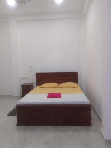 Ένα ή περισσότερα κρεβάτια σε δωμάτιο στο Nikita Homestay