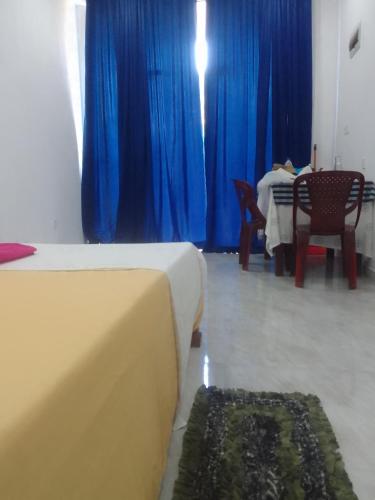 Ένα ή περισσότερα κρεβάτια σε δωμάτιο στο Nikita Homestay