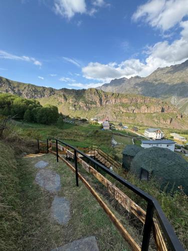 a view of a valley with mountains in the background at Glamping EmeralD in Stepantsminda