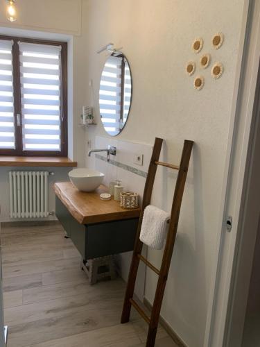 a bathroom with a sink and a mirror at Il Sogno di GioEle in Borgo San Dalmazzo
