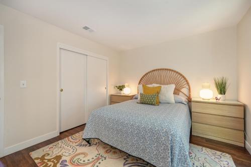 a bedroom with a bed and two night stands at Family-Friendly Getaway Near Slide Hill Park home in Davis