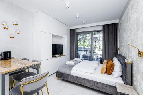 Postel nebo postele na pokoji v ubytování Balticus Apartamenty Standard Promenada Gwiazd 14