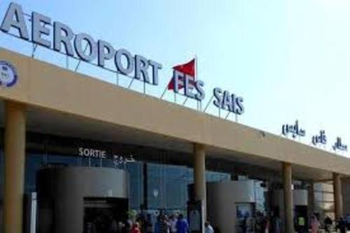 a store with a sign on top of a building at Stay 3 km near to Airport Fes Saiss in Fès