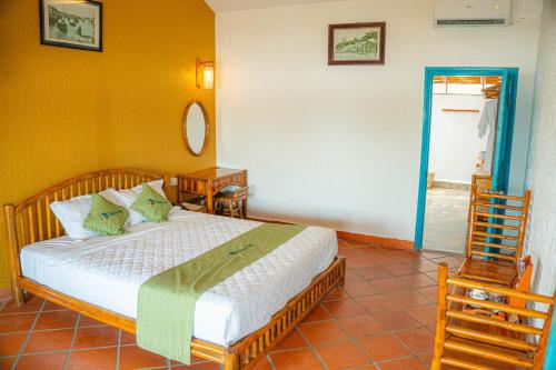 Ένα ή περισσότερα κρεβάτια σε δωμάτιο στο Mekong Lodge Resort