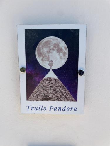 a picture of the trumpidium pamporia with the moon at I Trulli e la Luna in Alberobello
