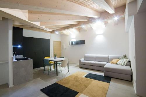 a living room with a couch and a table at Nuova Luxury Suite Chaligne in Aosta