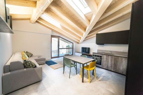 a living room with a couch and a table at Nuova Luxury Suite Chaligne in Aosta