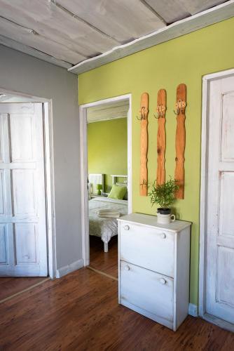 a room with a bedroom with a bed and a mirror at Ubytovanie na Šuňave in Vyšná Šuňava