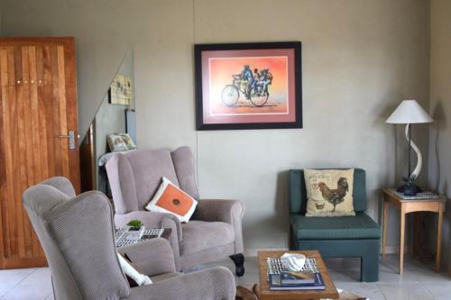 a living room with a chair and a chair at Karibu Self-Catering unit 2 in Omaruru